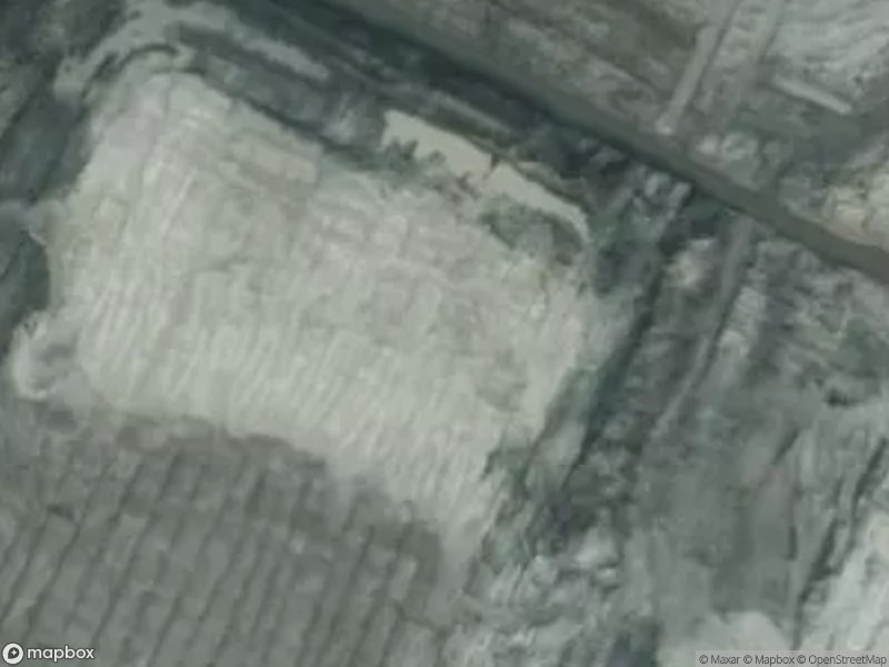 Aerial view of a cleared land area with distinct patterns and textures.