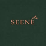 Text logo for "SEENÉ" in copper on a dark green background, featuring a small leaf design.