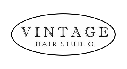 Logo for Vintage Hair Studio featuring elegant typography and decorative flourishes.