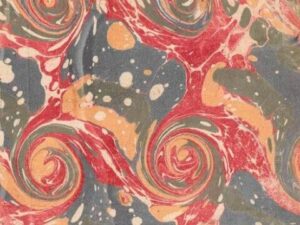 Colorful marbled paper featuring swirling patterns in red, blue, green, and cream.