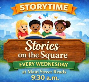 Four children gather around a large book, promoting weekly storytime at Main Street Reads.