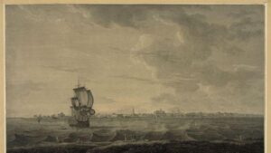 A sailing ship navigates through waves near a coastal town under a cloudy sky.